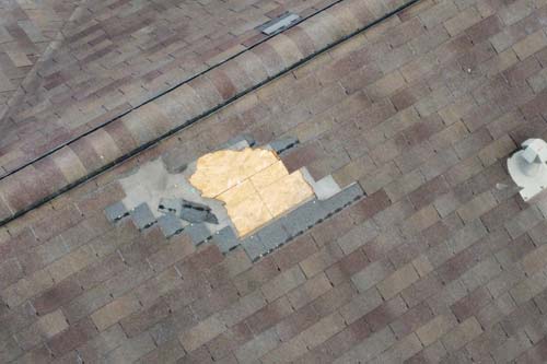 wind damaged shingles